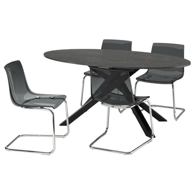 Modern black dining set with an oval table and four cantilever chairs. Sleek, tempered surfaces and steel frames.