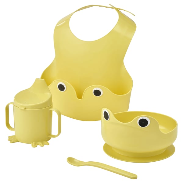 Yellow baby feeding set: bib, cup, bowl, spoon. Playful, functional design.