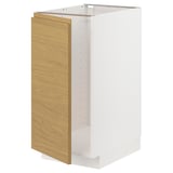 A white METOD kitchen cabinet with a light oak side panel and minimalist design.