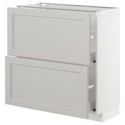 A white METOD base kitchen cabinet with beveled edges in a classic design. It two spacious drawers with smooth, self-closing mechanisms.