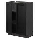 METOD kitchen cabinet in black stained wood with beveled edges.