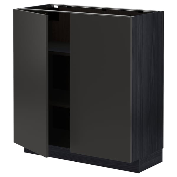 A black METOD kitchen cabinet with one open door, revealing an empty shelf. It has a sleek, modern design.