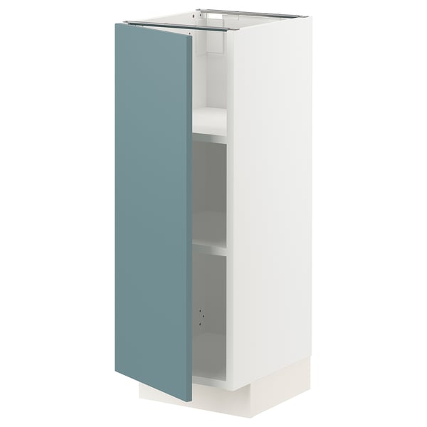 This image shows a modern white METOD kitchen cabinet with a light blue door, featuring a sleek, minimalist design.