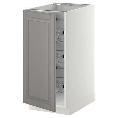 A grey METOD kitchen cabinet with a beveled door and pull-out wire baskets.