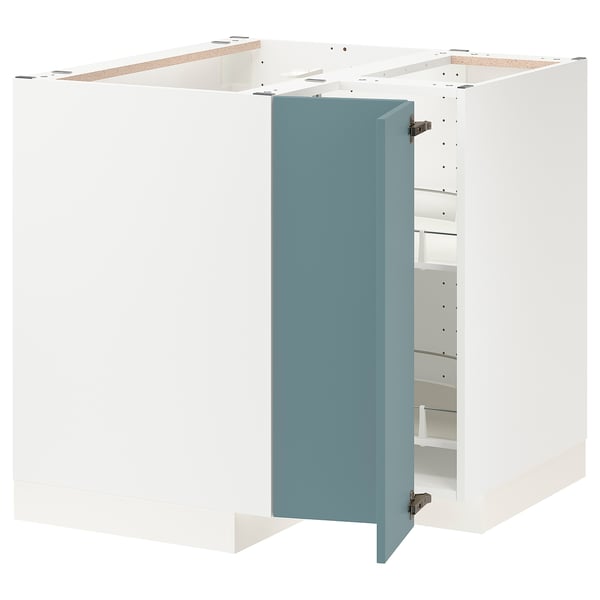 This image shows an open white corner cabinet with a blue door in a modern kitchen setup. Its part of the METOD system and adjustable shelves.