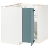 This image shows an open white corner cabinet with a blue door in a modern kitchen setup. Its part of the METOD system and adjustable shelves.