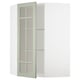 A green METOD corner cabinet with glass doors and adjustable shelves.