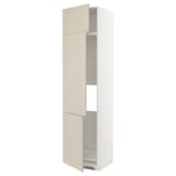 Beige kitchen cabinet with white frame and adjustable shelves.