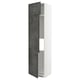 A tall white METOD kitchen cabinet with dark grey concrete effect doors, featuring adjusted shelves and a modern urban design.