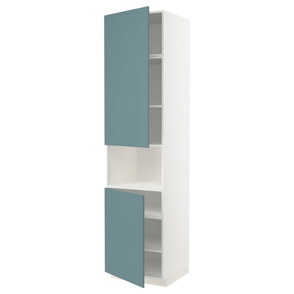 Turquoise METOD kitchen cabinet with open door, sleek white sides, adjustable shelves, modern design.