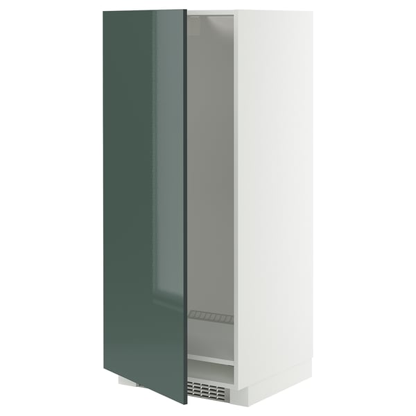 A METOD kitchen cabinet with high-gloss grey-green door open, revealing the interior with an adjustable shelf and ventilated plinth.
