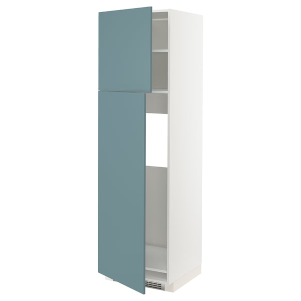 A white METOD tall cabinet with turquoise havstorp doors slightly open, revealing adjustable shelves, designed for modern kitchens.