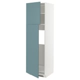 A white METOD tall cabinet with turquoise havstorp doors slightly open, revealing adjustable shelves, designed for modern kitchens.