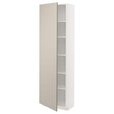 A beige ikea METOD kitchen cabinet with a door open, revealing adjustable shelves.