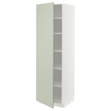 A white METOD kitchen cabinet with a light green stensund door, featuring vertical grooves, and three adjustable shelves inside.