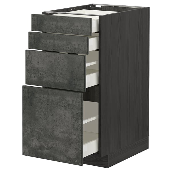 METOD kitchen unit with three grey concrete drawers. Tall, rectangular, dark wood sides, smooth metal handles.