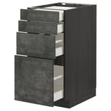 METOD kitchen unit with three grey concrete drawers. Tall, rectangular, dark wood sides, smooth metal handles.