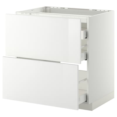 White high-gloss kitchen unit with drawers, sleek design.