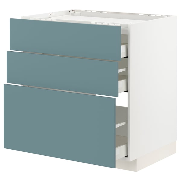 Modern kitchen unit with three blue drawers and white base. Sleek and minimalist design. Soft-close drawers, turquoise fronts.