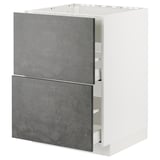 The METOD kitchen unit a white frame and dark grey concrete effect drawers. Modern and sleek design is perfect for urban kitchen aesthetics.