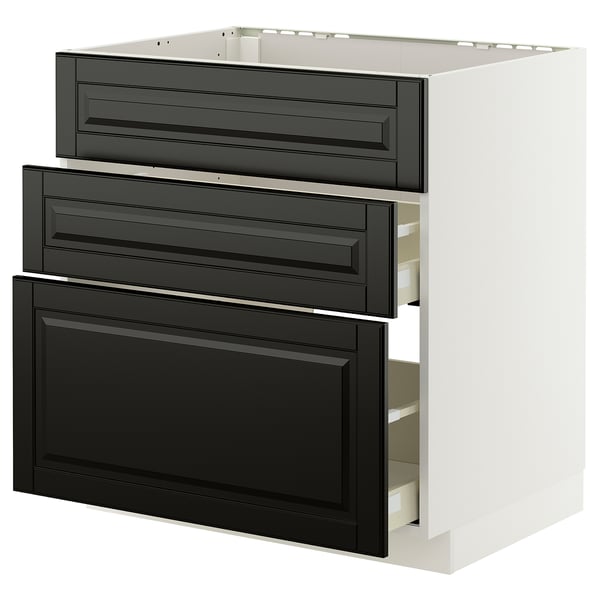 Modern white kitchen cabinet with three black beveled drawers.