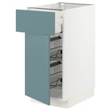 A METOD kitchen cabinet with a turquoise drawers and a white frame. It multiple wire shelves inside the drawer.