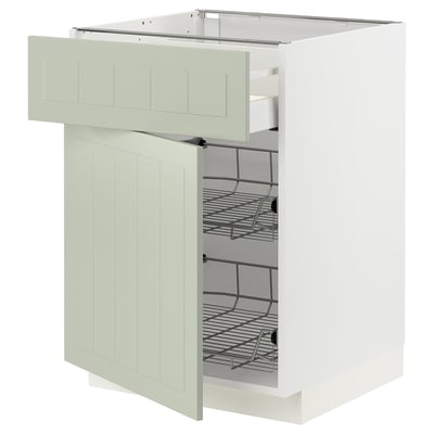 Open white kitchen cabinet with pull-out wire basket, light green panel doors.