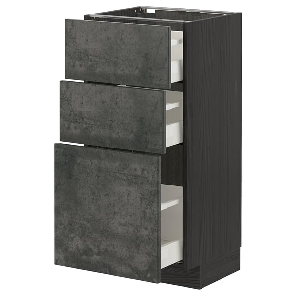 This image the METOD kitchen unit with dark grey concrete effect drawers, framed in black. It has three pull-out drawers with a sleek, modern design.