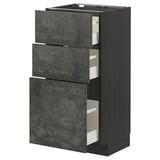 This image the METOD kitchen unit with dark grey concrete effect drawers, framed in black. It has three pull-out drawers with a sleek, modern design.