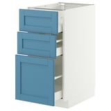 A white and blue METOD kitchen cabinet with three blue drawers. The design is sleek and modern with smooth running drawers.