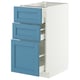 A white and blue METOD kitchen cabinet with three blue drawers. The design is sleek and modern with smooth running drawers.
