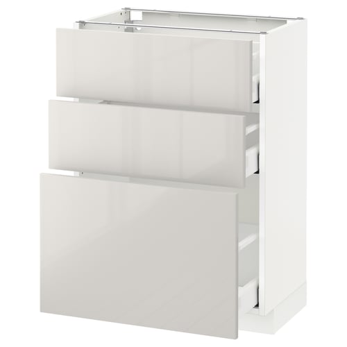 Modern white gloss kitchen unit with three open drawers.