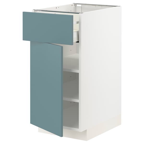 A white ikea METOD kitchen cabinet with a turquoise drawer and door, featuring a sleek modern design.