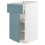 A white ikea METOD kitchen cabinet with a turquoise drawer and door, featuring a sleek modern design.