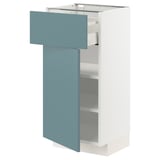 A white METOD kitchen cabinet with a turquoise drawer and fixed shelves. It has a modern, smooth design with contrasting colors.