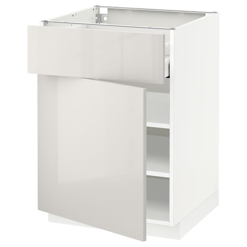 A white METOD kitchen cabinet with a modern, glossy grey finish and smooth running drawers.
