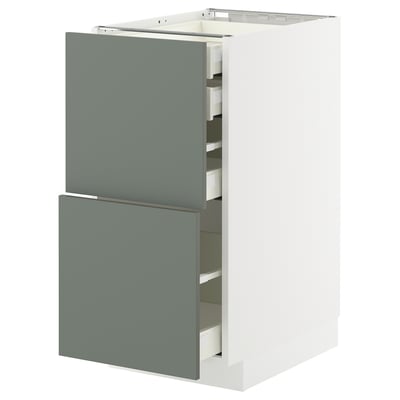 Modular kitchen cabinet, greenish-grey, with multiple drawers, sleek design.