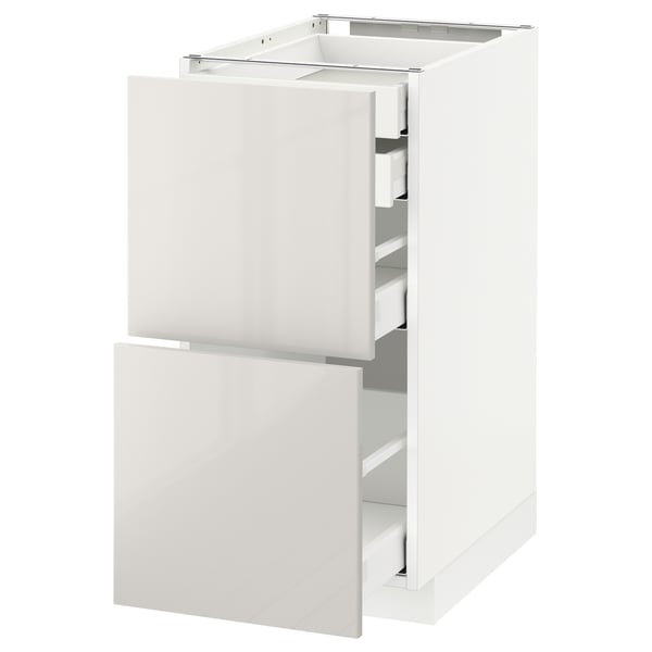 White METOD kitchen cabinet with glossy drawers. Three drawers, modern and rectangular.