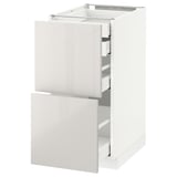 White METOD kitchen cabinet with glossy drawers. Three drawers, modern and rectangular.