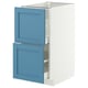 A white IKEA METOD kitchen cabinet with blue drawers, featuring a modern design with smooth edges.
