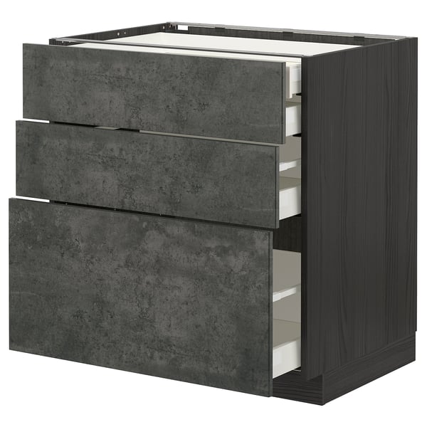 An open dark grey ikea METOD kitchen cabinet with three drawers, featuring a clever design and urban look.