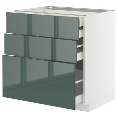 Modern green-gloss kitchen cabinet with three pull-out drawers.