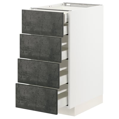 A white METOD kitchen unit with dark grey concrete effect drawers. It four pull-out drawers with a sleek, modern design.