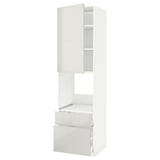 A white METOD kitchen cabinet with a high gloss finish, sleek design, and modern storage.