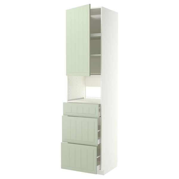 A METOD kitchen unit with green stensund fronts, featuring drawers and cabinets for storage.