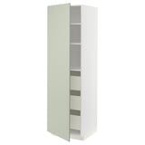 METOD kitchen unit in light green with vertical grooves, tall and narrow, open showing shelves.