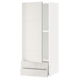 A white modern METOD kitchen cabinet with a glass door. It has a sleek, glossy design and a pull-out drawer.
