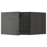 A dark grey kitchen cabinet from ikeas METOD system with a modern, urban design.