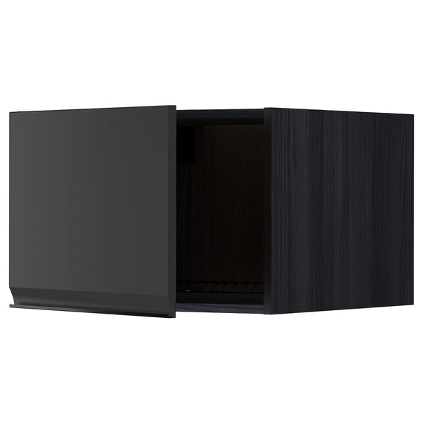 Black kitchen cabinet with open door, modern design, dark wood finish.
