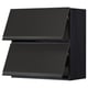 Modern black kitchen unit with sleek, dark finish and minimalist design.